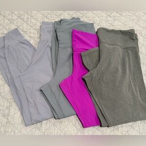 Set of Four Athleta Leggings/Joggers. Good condition. Piling shown.